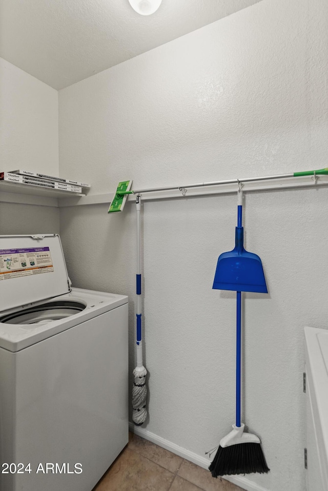 washroom with light tile patterned floors and washer / clothes dryer