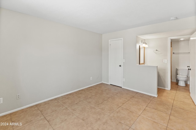 spare room with light tile patterned floors