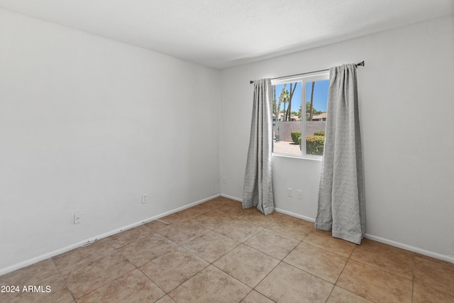 view of tiled spare room