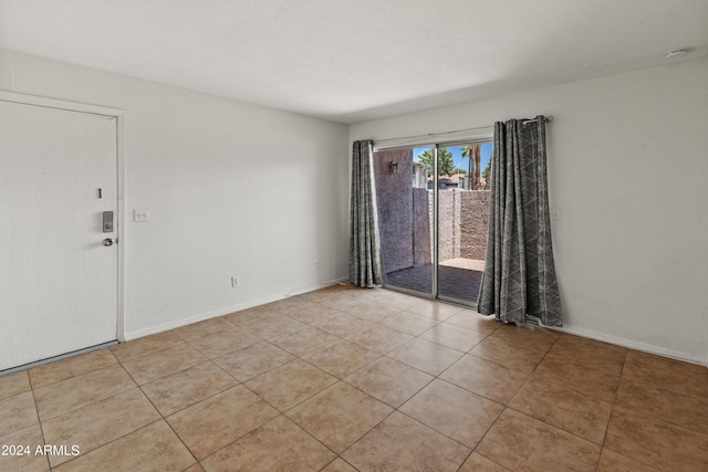 view of tiled spare room