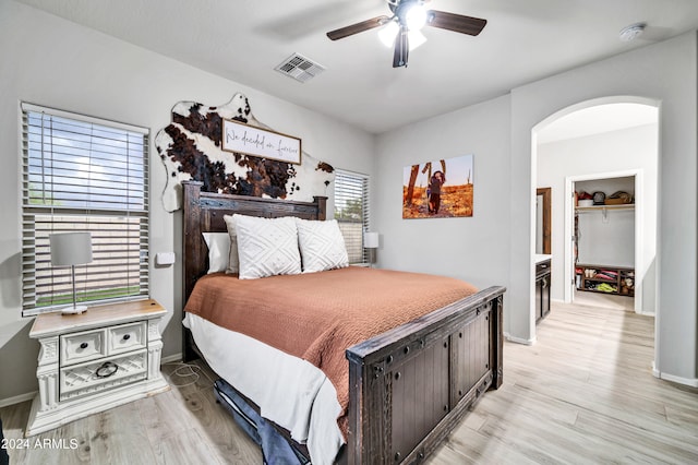 bedroom featuring ceiling fan and light hardwood / wood-style floors