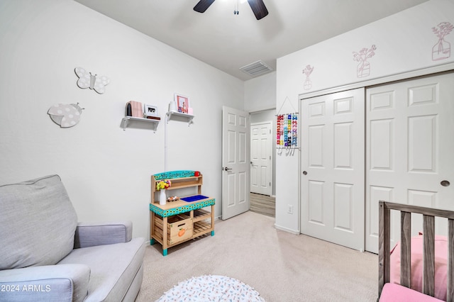 carpeted bedroom with a closet and ceiling fan