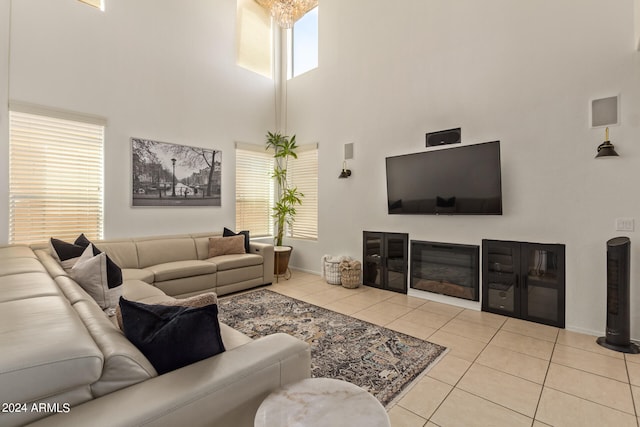 tiled living room with a high ceiling