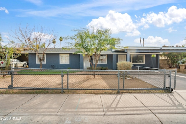 ranch-style home featuring a carport