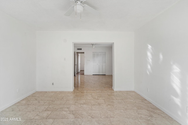 empty room featuring ceiling fan