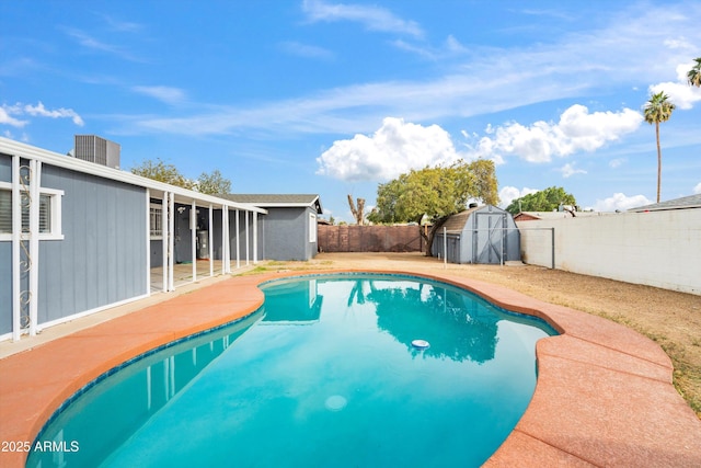 view of pool with a storage unit