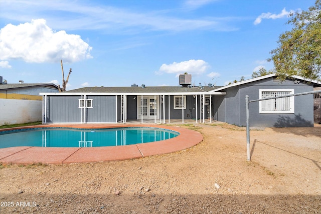 view of swimming pool with central AC and a patio