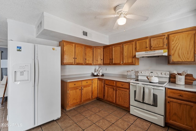 kitchen with white appliances, a textured ceiling, ceiling fan, and light tile patterned flooring