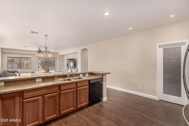 kitchen with ceiling fan, black dishwasher, dark wood-type flooring, hanging light fixtures, and sink