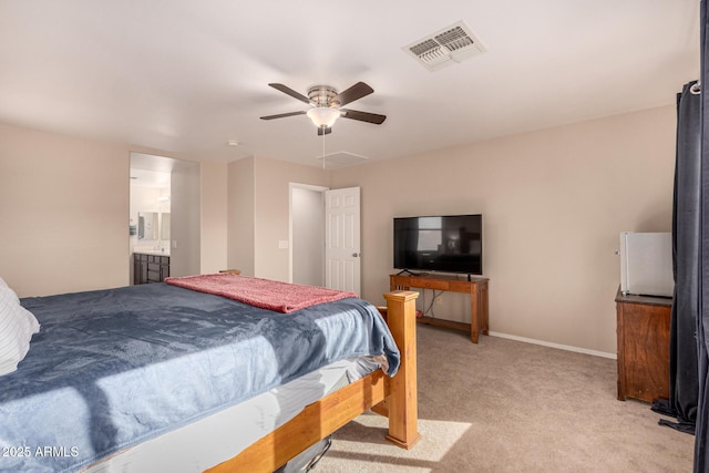 carpeted bedroom with ceiling fan and connected bathroom