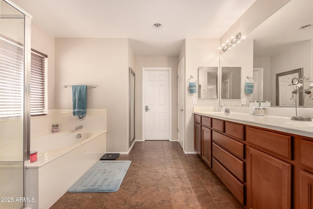 bathroom featuring vanity and plus walk in shower