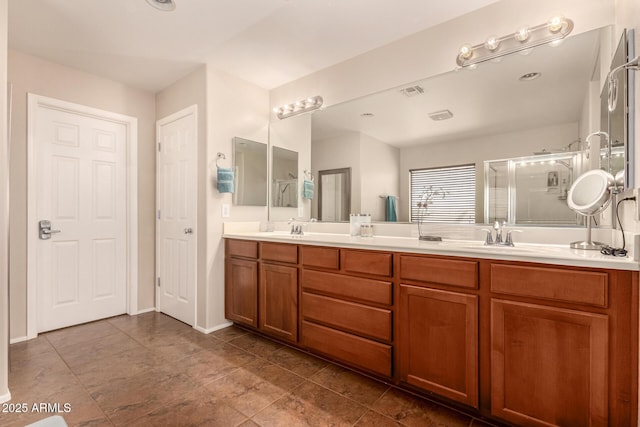 bathroom with walk in shower and vanity