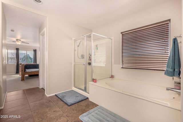 bathroom with ceiling fan, tile patterned flooring, and plus walk in shower