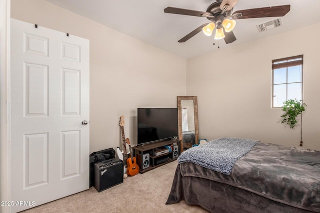 bedroom with light carpet and ceiling fan