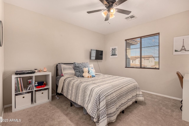 bedroom with ceiling fan and light colored carpet