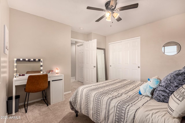 bedroom featuring ceiling fan and light carpet