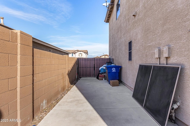 view of side of home with a patio area