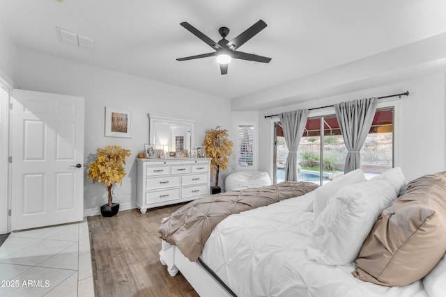 bedroom with access to outside, ceiling fan, and light hardwood / wood-style floors