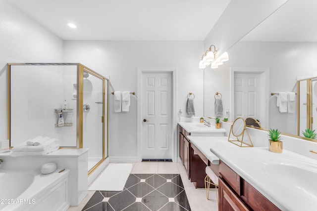 bathroom with independent shower and bath, vanity, and tile patterned floors