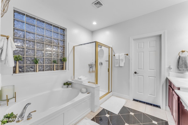 bathroom featuring vanity, separate shower and tub, and tile patterned floors