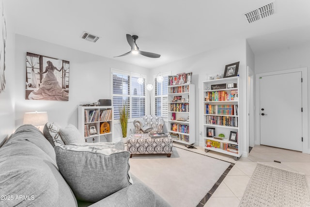 sitting room with ceiling fan and light tile patterned flooring