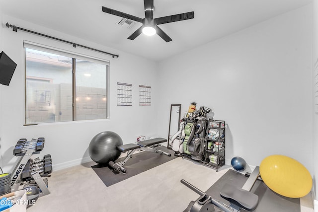 exercise room with carpet floors and ceiling fan