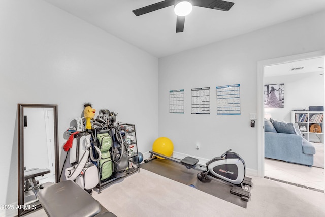 exercise room with ceiling fan