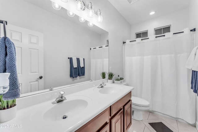 bathroom with vanity, tile patterned floors, and toilet