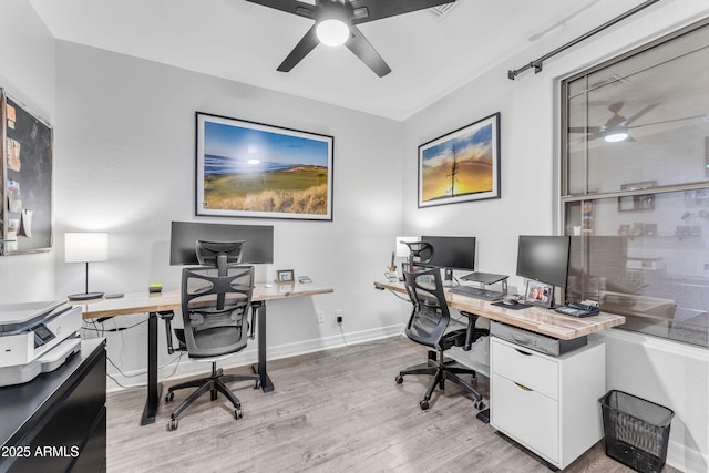 home office with ceiling fan and light wood-type flooring