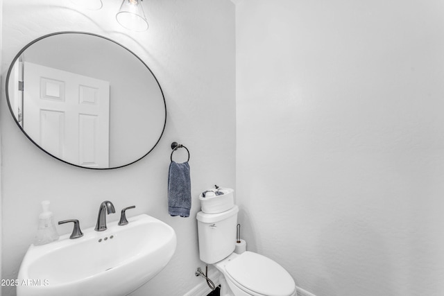 bathroom with sink and toilet