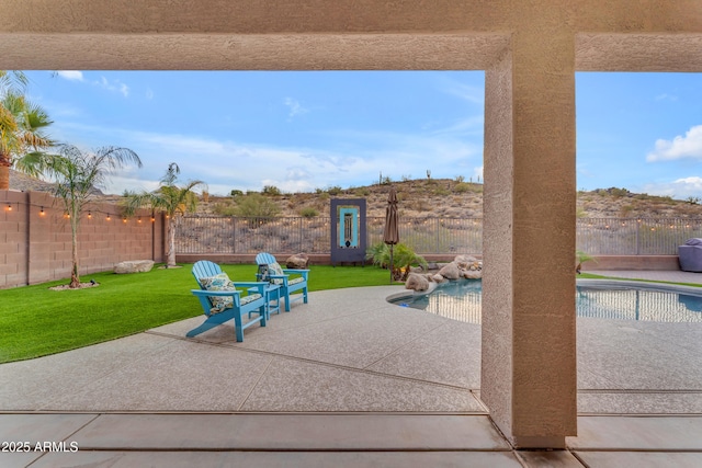 view of patio featuring a fenced in pool