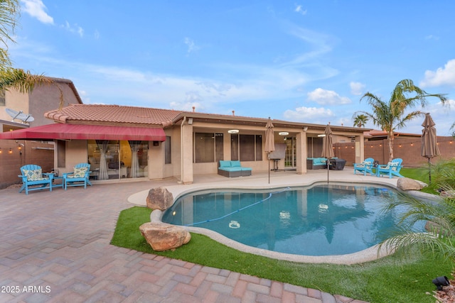 view of pool featuring an outdoor living space and a patio