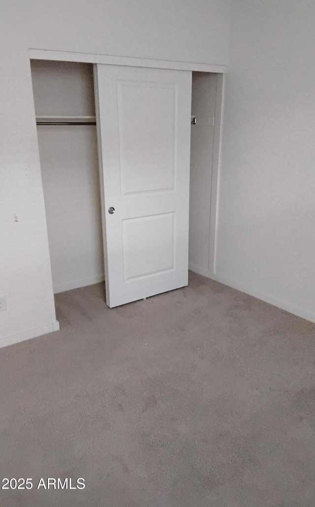 7284 E Gamebird Way, San Tan Valley, AZ 85143 - unfurnished bedroom with carpet floors and a closet