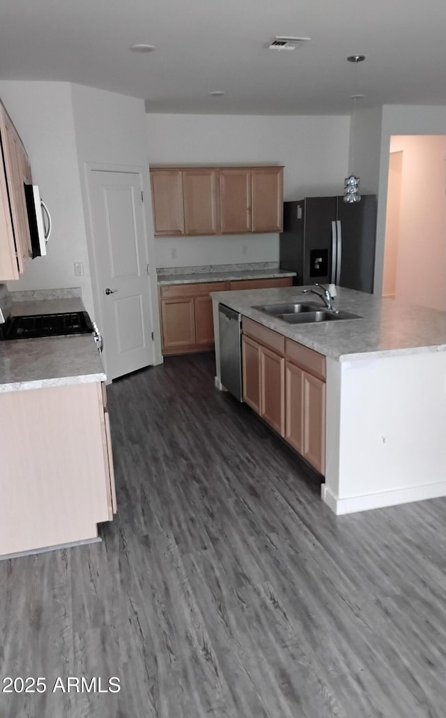 7284 E Gamebird Way, San Tan Valley, AZ 85143 - kitchen featuring stainless steel appliances, dark wood finished floors, light countertops, a kitchen island with sink, and light brown cabinets