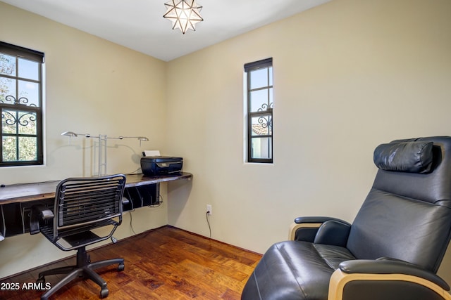 home office with dark wood-style flooring