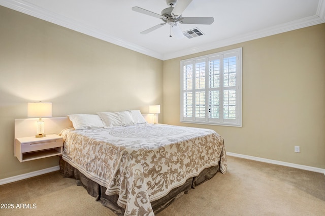 carpeted bedroom with baseboards, crown molding, and ceiling fan