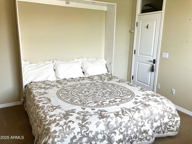 bedroom featuring carpet flooring and baseboards
