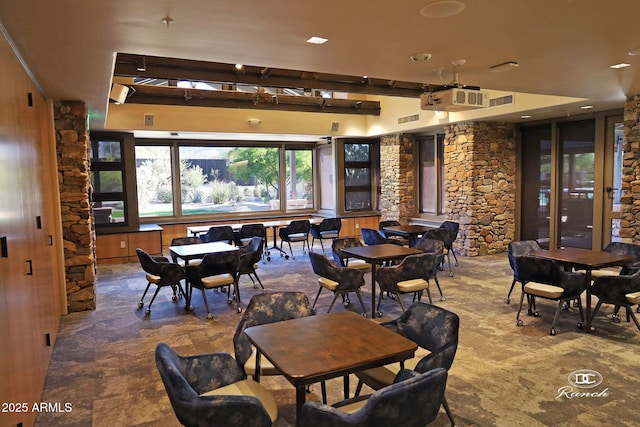 dining area featuring beam ceiling and recessed lighting
