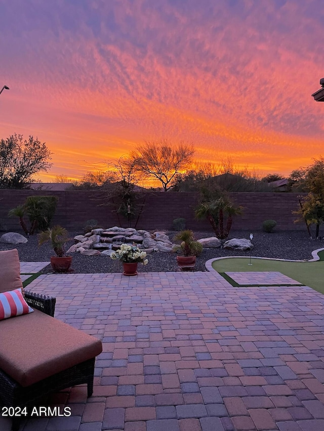 view of patio terrace at dusk