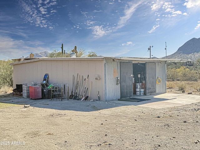 view of outdoor structure with a mountain view