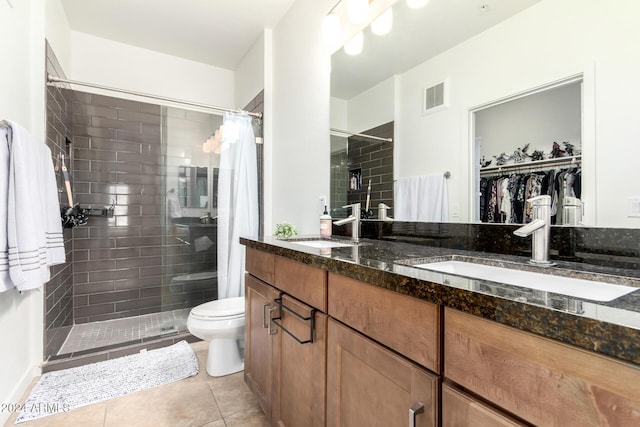 bathroom with tile patterned floors, vanity, toilet, and a shower with shower curtain