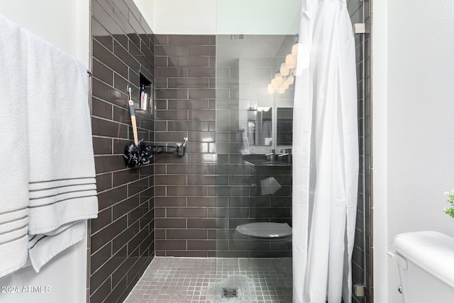 bathroom with a shower with curtain and toilet