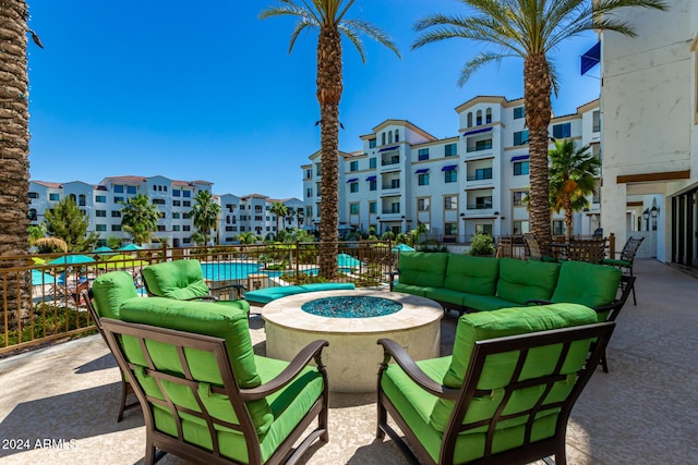 view of patio / terrace featuring an outdoor living space with a fire pit