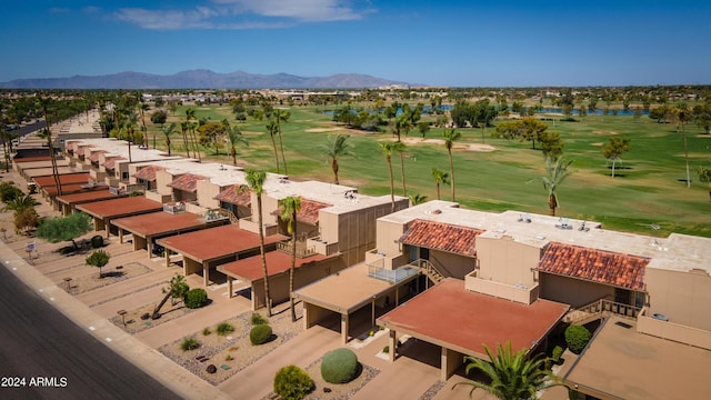 birds eye view of property with a mountain view