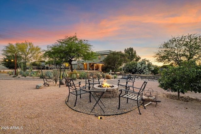 19428 E Hunt Hwy, Queen Creek, AZ 85142 - patio terrace at dusk featuring an outdoor fire pit