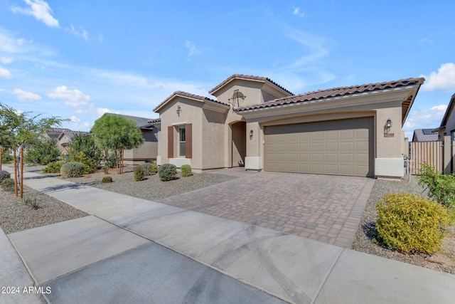 mediterranean / spanish house featuring a garage