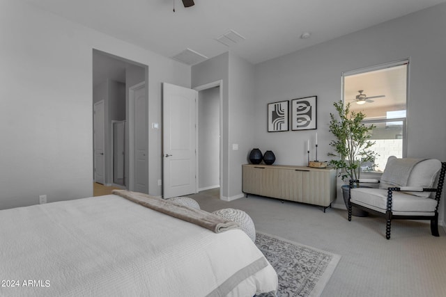 bedroom with light colored carpet and ceiling fan