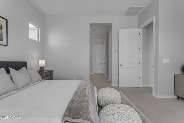 bedroom with light colored carpet