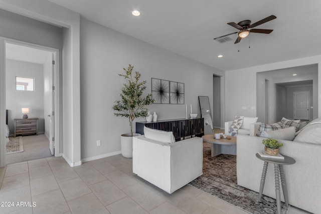 tiled living room with ceiling fan