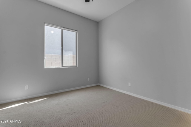 carpeted empty room with ceiling fan